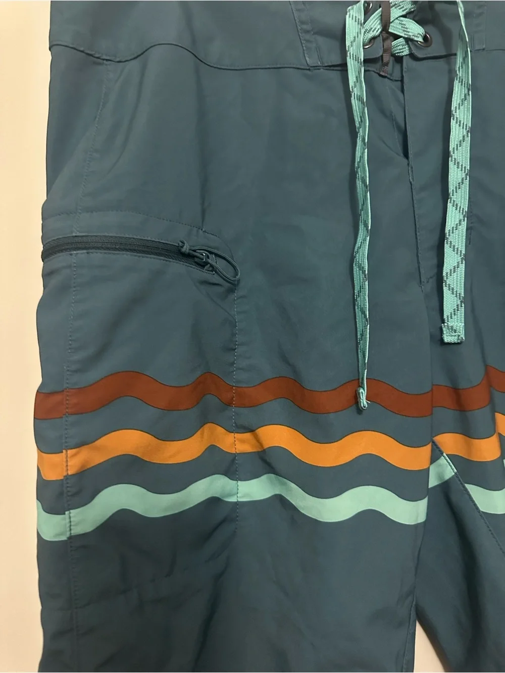 Patagonia Teal Board Shorts with Multicolor Wave Stripes
